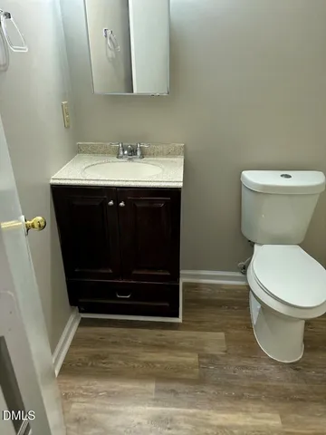 a bathroom with a sink toilet and vanity