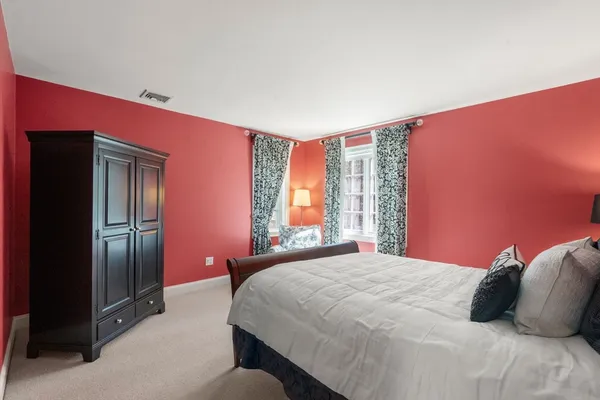 a bedroom with a bed and a closet