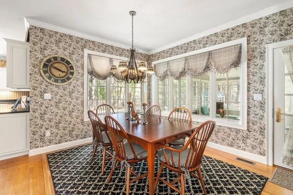 a dining room with furniture and window
