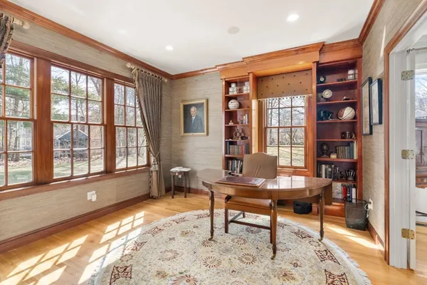 a workspace with furniture and a window