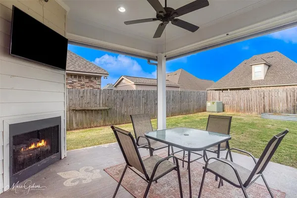 a view of a livingroom with furniture and a fireplace