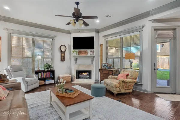 a living room with furniture fireplace and a flat screen tv