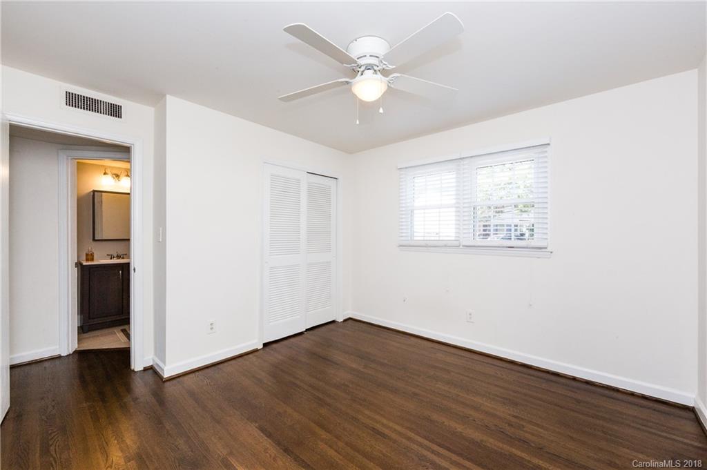 920 McAlway Road, Unit C Charlotte, NC 28211 - Photo 17 of 27 a view of an empty room with wooden floor