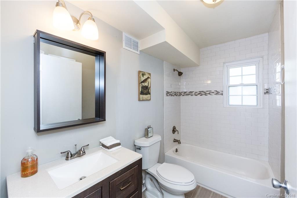 920 McAlway Road, Unit C Charlotte, NC 28211 - Photo 21 of 27 a bathroom with a sink a toilet and shower