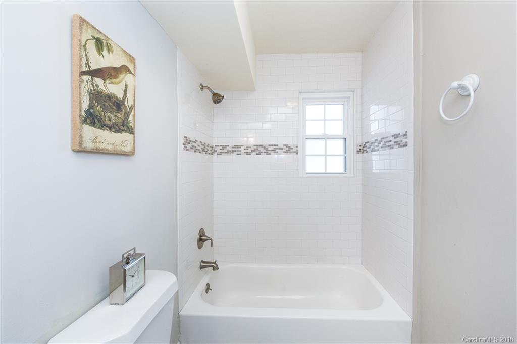 920 McAlway Road, Unit C Charlotte, NC 28211 - Photo 22 of 27 a bathroom with a bathtub and shower