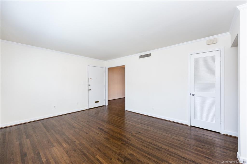 920 McAlway Road, Unit C Charlotte, NC 28211 - Photo 8 of 27 a view of an empty room with wooden floor