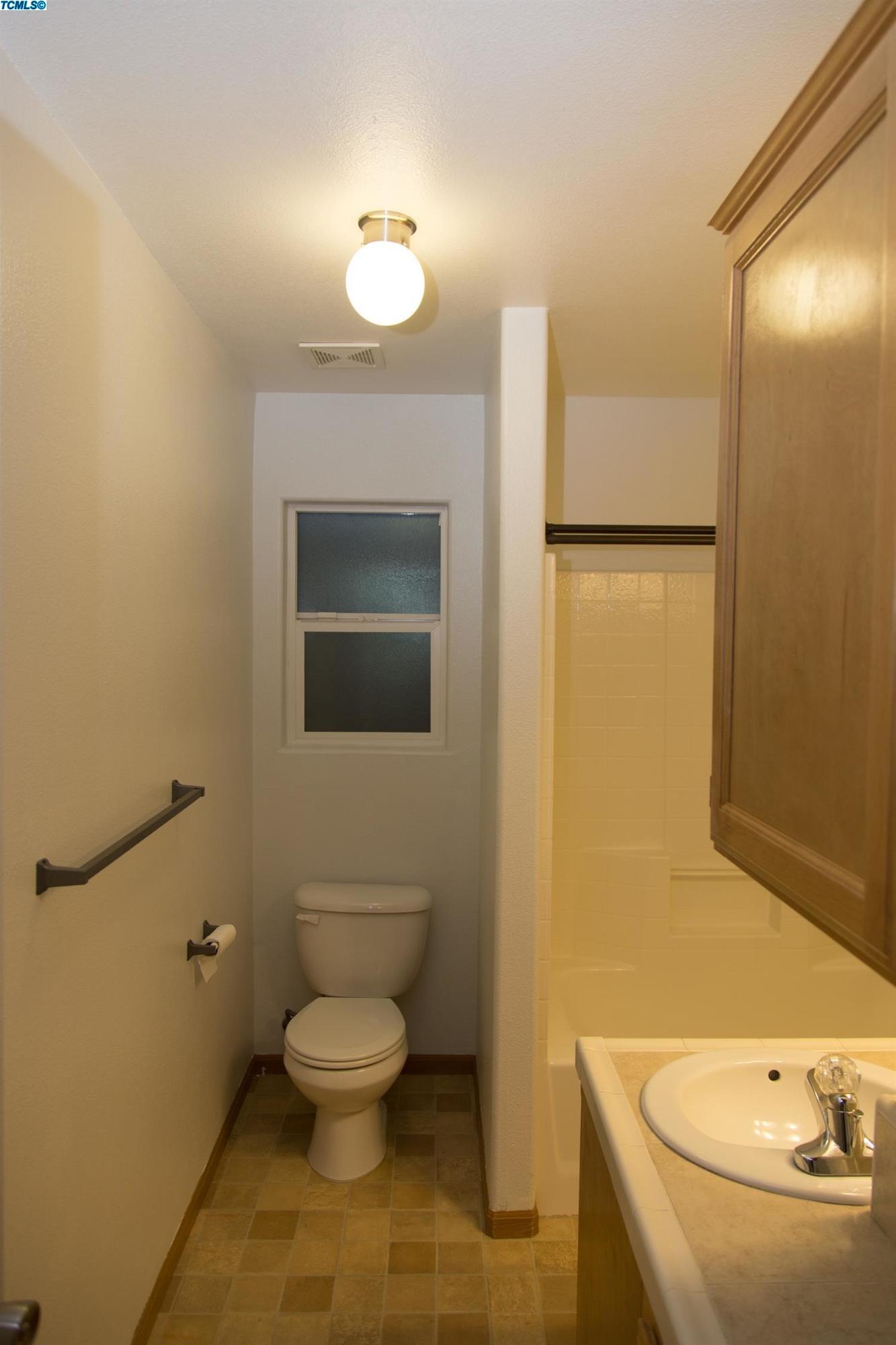 148 South Filbert Road Exeter, CA 93221 - Photo 17 of 23 a bathroom with a toilet and a sink