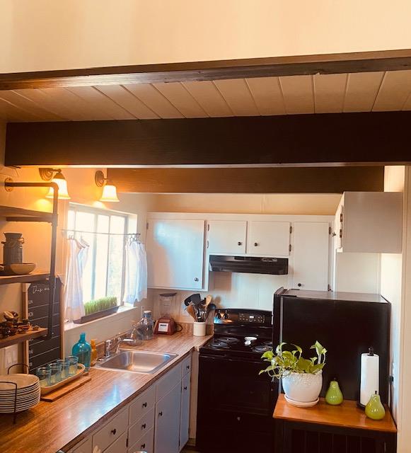 2423 Quail Hill Road Copperopolis, CA 95228 - Photo 7 of 17 a kitchen with a sink cabinets and window
