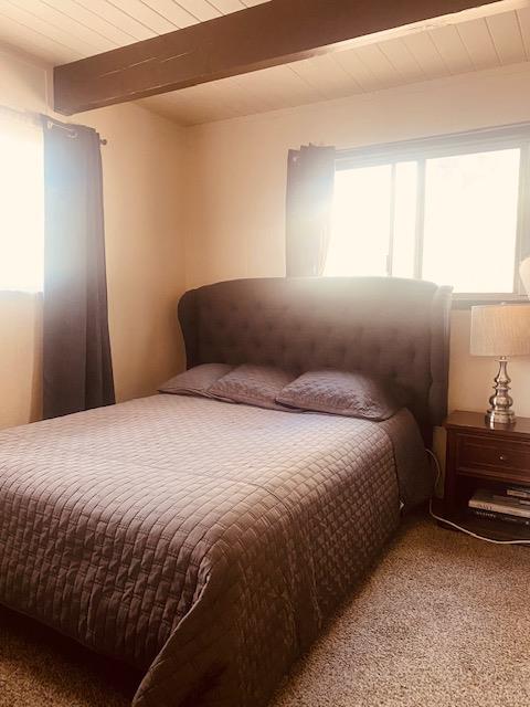 2423 Quail Hill Road Copperopolis, CA 95228 - Photo 10 of 17 a bedroom with a bed and window