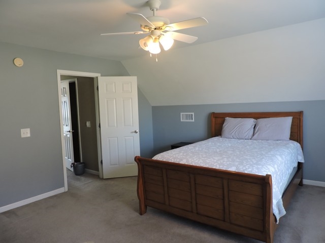 61 Sugar Loaf Road Staunton, VA 24401 - Photo 26 of 43 a bedroom with a bed and a chandelier fan