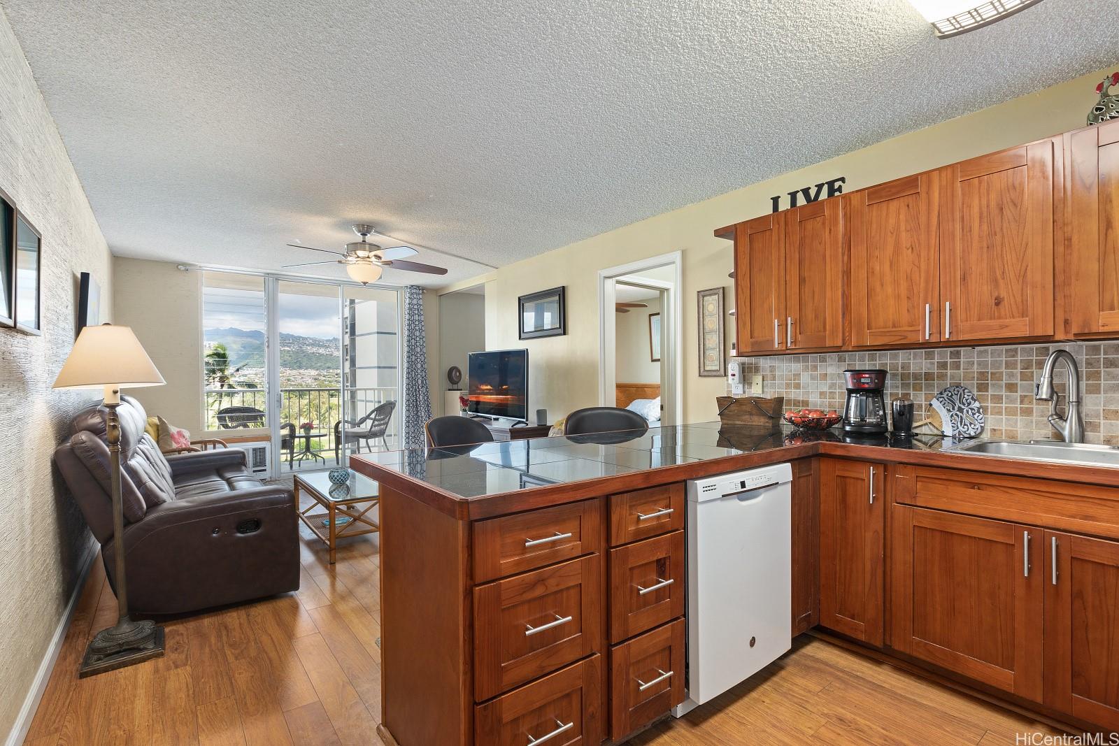 a kitchen with cabinets a sink and appliances