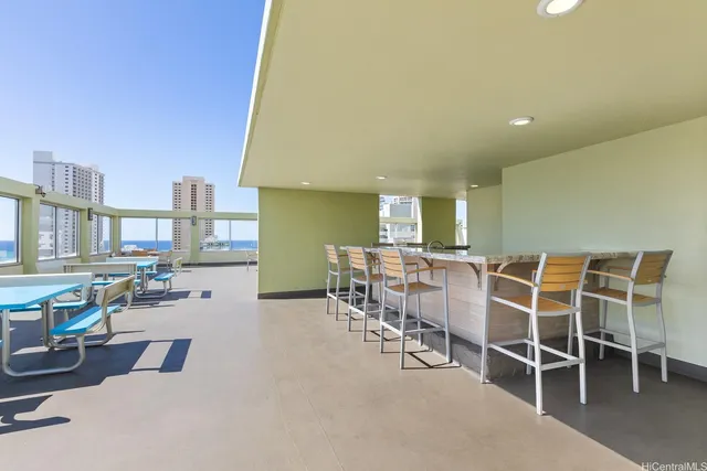 a dining room with furniture and a floor to ceiling window