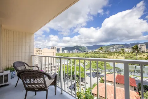 a view of a chairs and table in patio