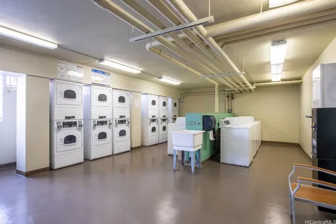a view of a room with workspace and a window