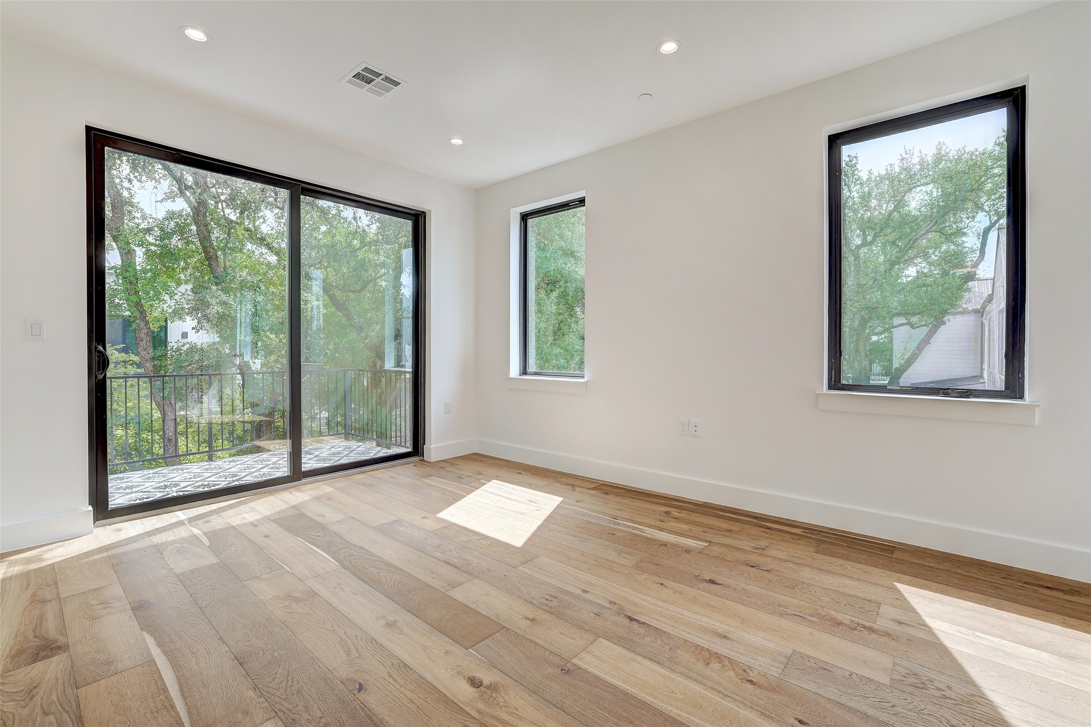 3208 Clawson Road, Unit 5A Austin, TX 78704 - Photo 23 of 34 Unfurnished room featuring light wood-style floors and recessed lighting