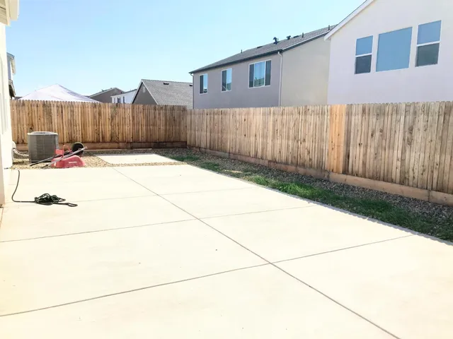 a view of a backyard of the house