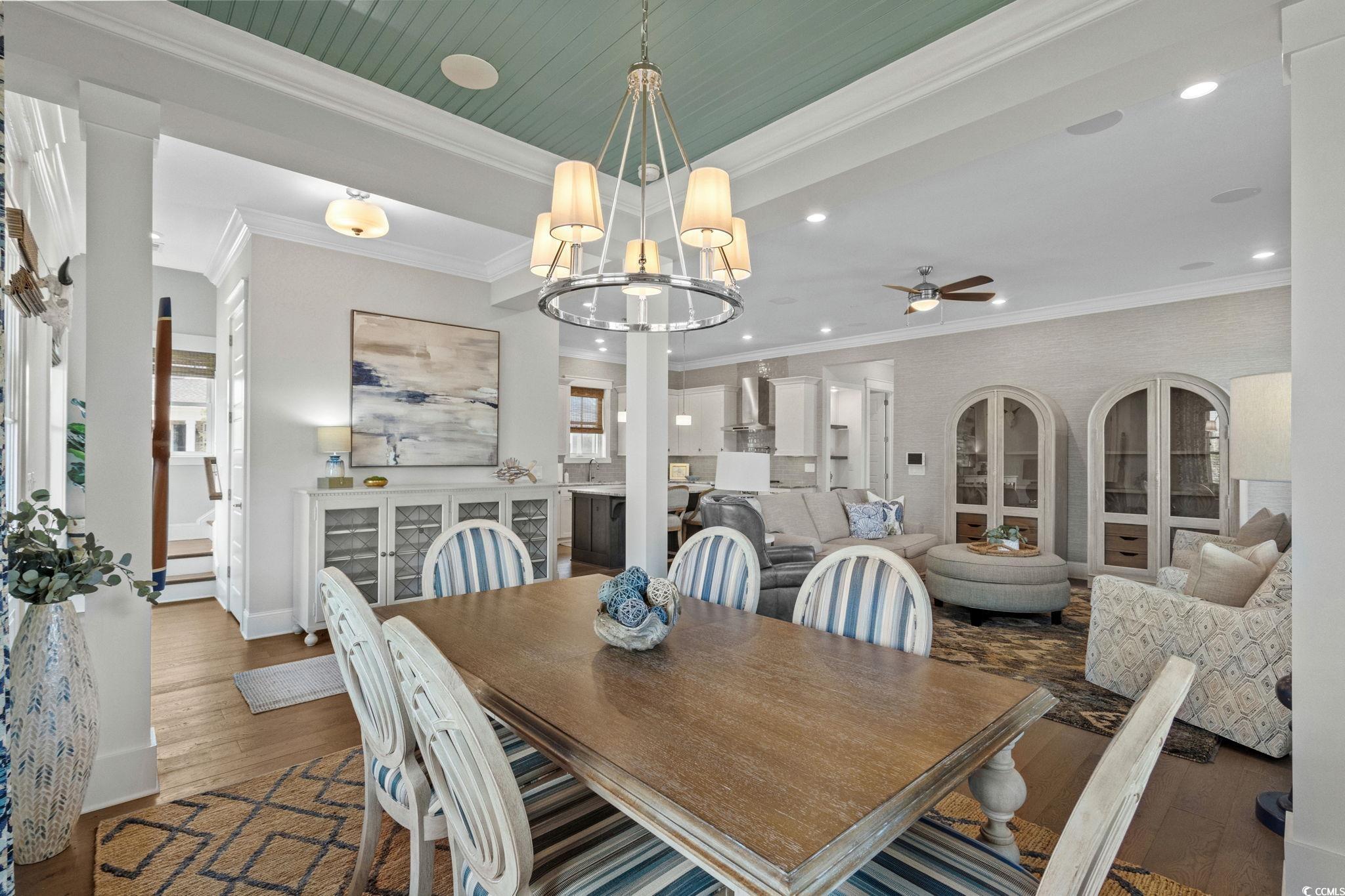8245 Sandlapper Way Myrtle Beach, SC 29572 - Photo 11 of 40 Dining area with wood finished floors, recessed lighting, decorative ceiling, a chandelier, and a ceiling fan