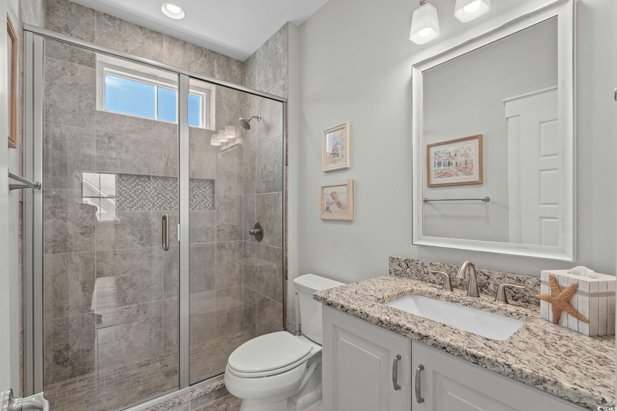 8245 Sandlapper Way Myrtle Beach, SC 29572 - Photo 30 of 40 Full bath with vanity and a tiled stall