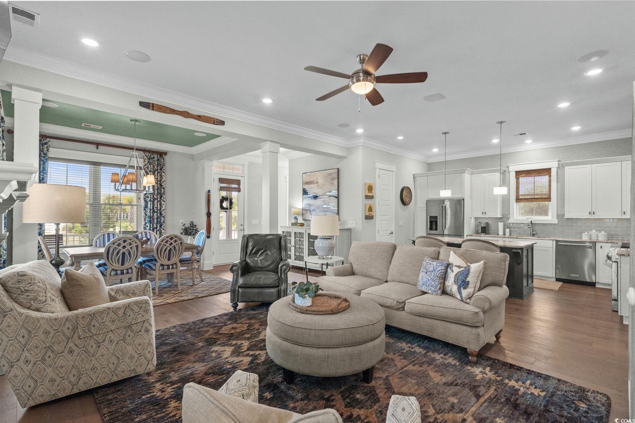 8245 Sandlapper Way Myrtle Beach, SC 29572 - Photo 10 of 40 Living area featuring wood finished floors, ceiling fan, healthy amount of natural light, and recessed lighting