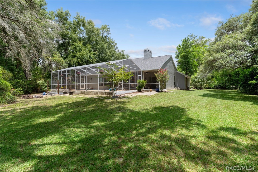 2460 West Pine Ridge Boulevard Beverly Hills, FL 34465 - Photo 36 of 47 a front view of house with yard and green space