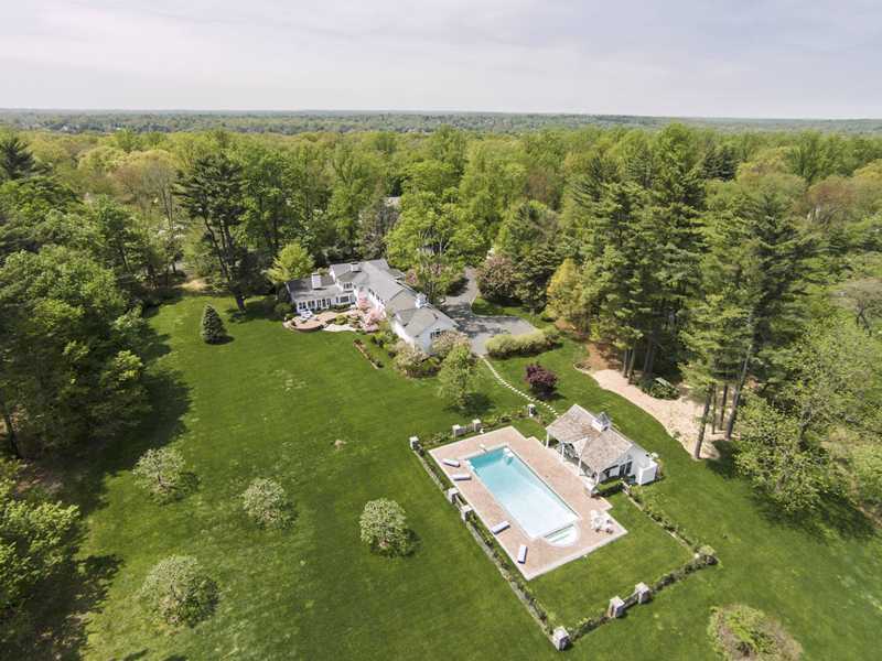 490 Hollow Tree Ridge Road Darien, CT 06820 - Photo 1 of 25 an aerial view of residential houses with outdoor space and trees