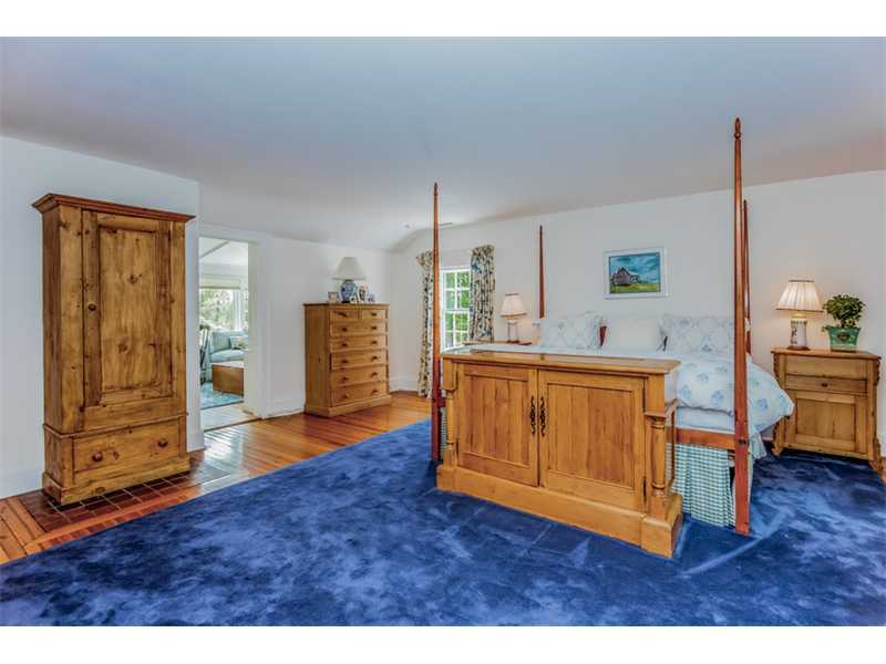 490 Hollow Tree Ridge Road Darien, CT 06820 - Photo 18 of 25 a living room with furniture and a dresser