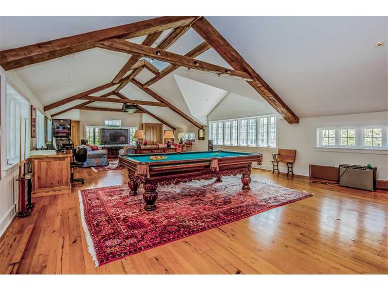 490 Hollow Tree Ridge Road Darien, CT 06820 - Photo 20 of 25 a living room with furniture a rug and a wooden floor