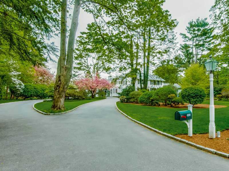 490 Hollow Tree Ridge Road Darien, CT 06820 - Photo 5 of 25 a view of a garden with a tree in the background