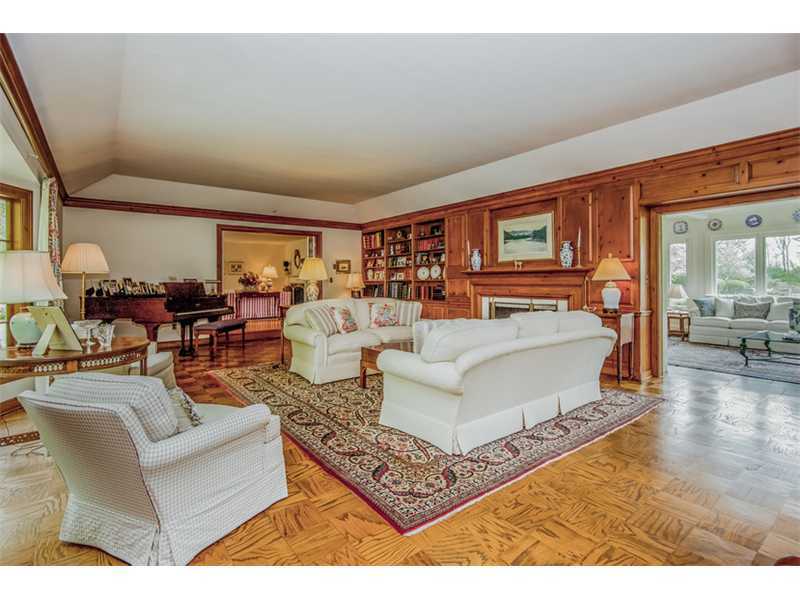 490 Hollow Tree Ridge Road Darien, CT 06820 - Photo 6 of 25 a living room with furniture and a table