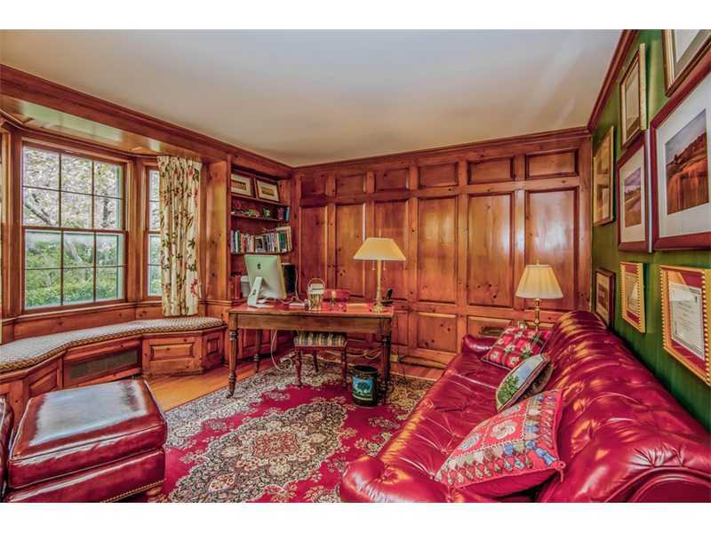 490 Hollow Tree Ridge Road Darien, CT 06820 - Photo 9 of 25 a living room with a bed furniture and a large window