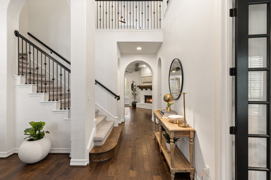 a view of an entryway with wooden floor