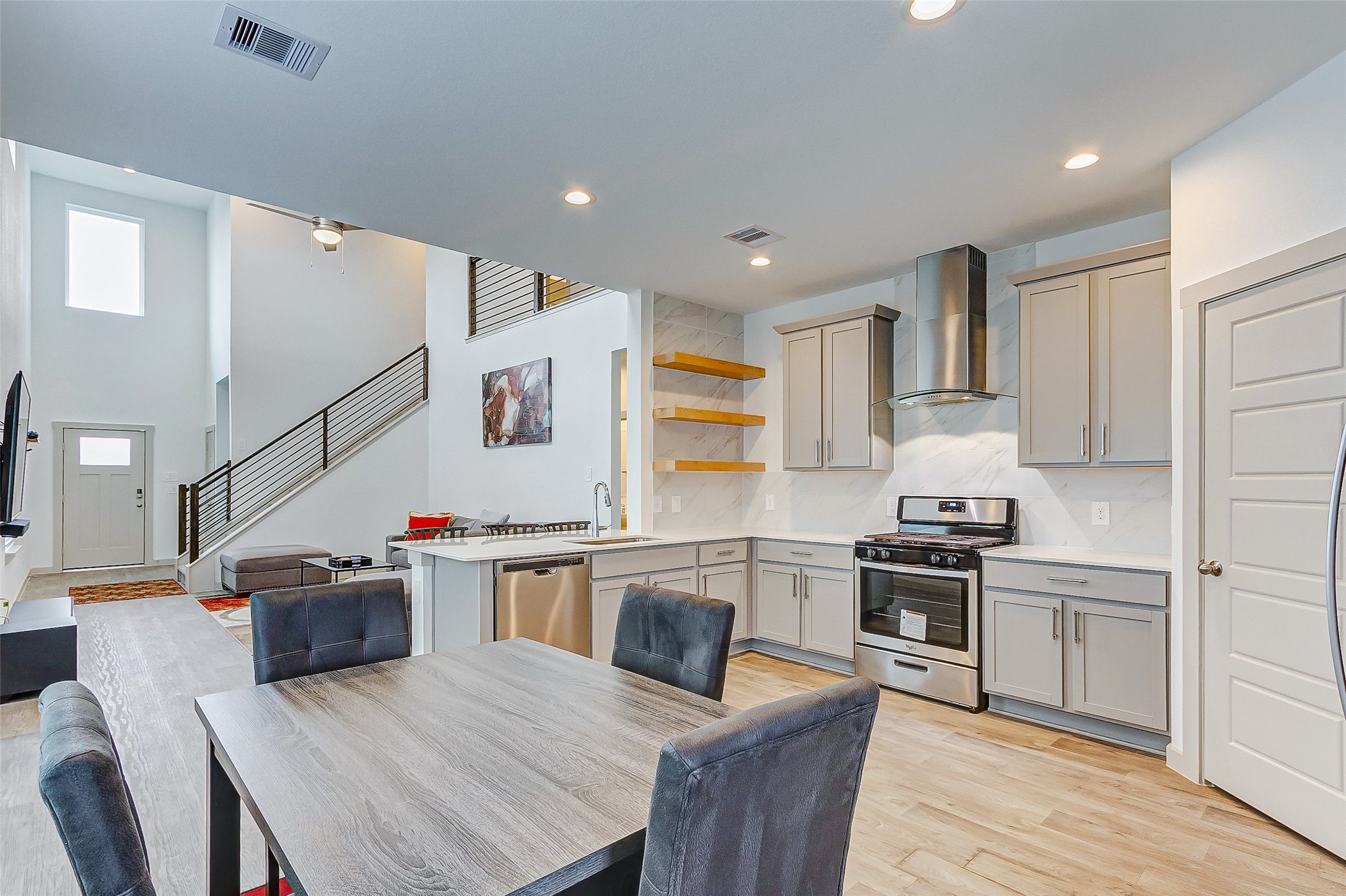 12514 Walmgate Court Houston, TX 77047 - Photo 14 of 37 a kitchen with granite countertop a sink stove and refrigerator