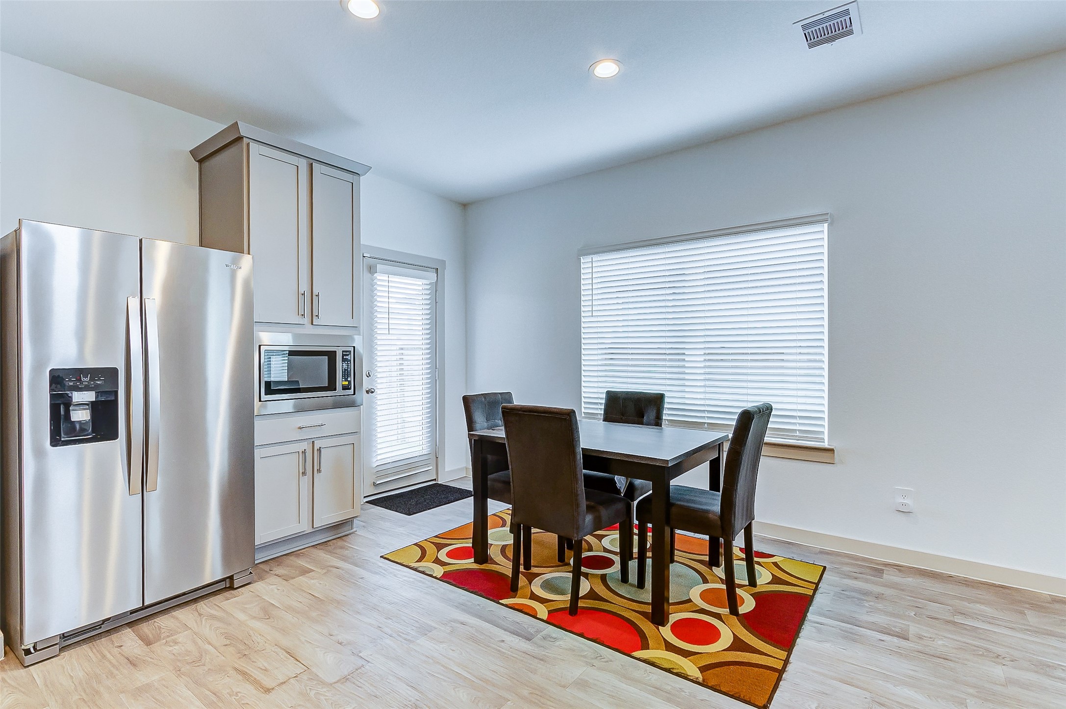12514 Walmgate Court Houston, TX 77047 - Photo 17 of 37 a view of a dining room with furniture and a refrigerator