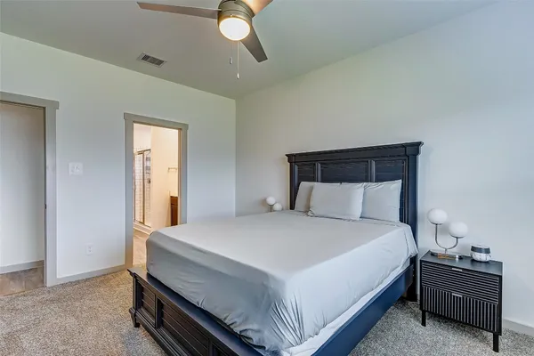 a bedroom with a bed and window