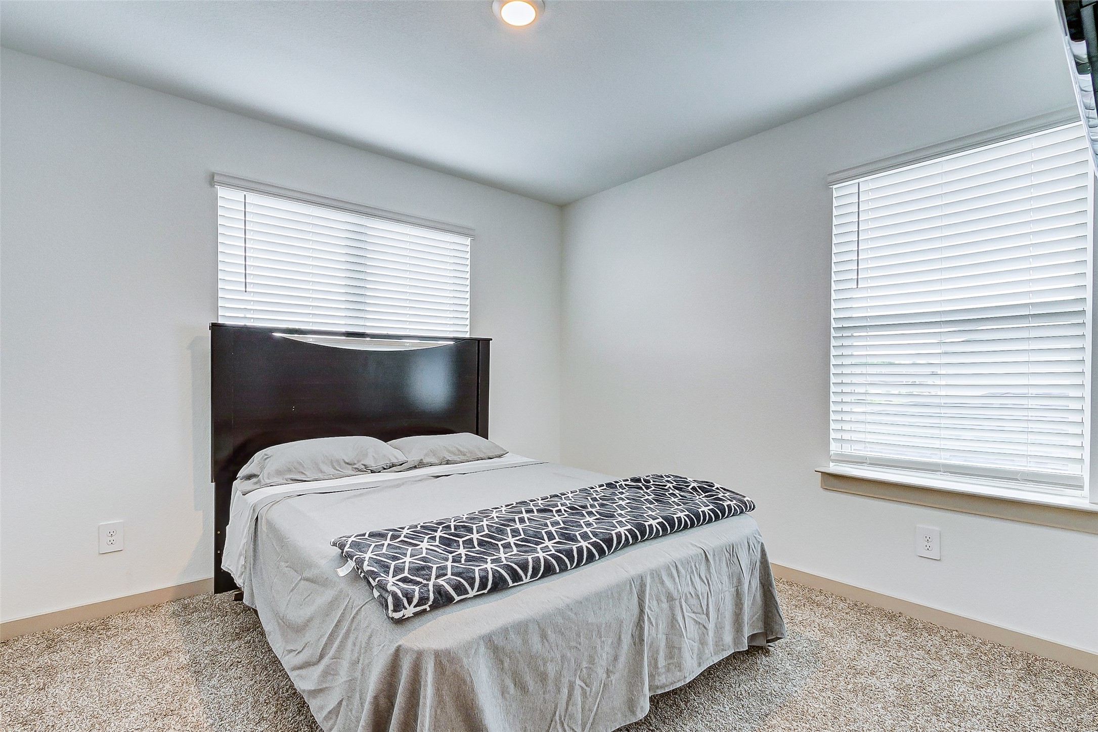 12514 Walmgate Court Houston, TX 77047 - Photo 28 of 37 a bedroom with a bed and window