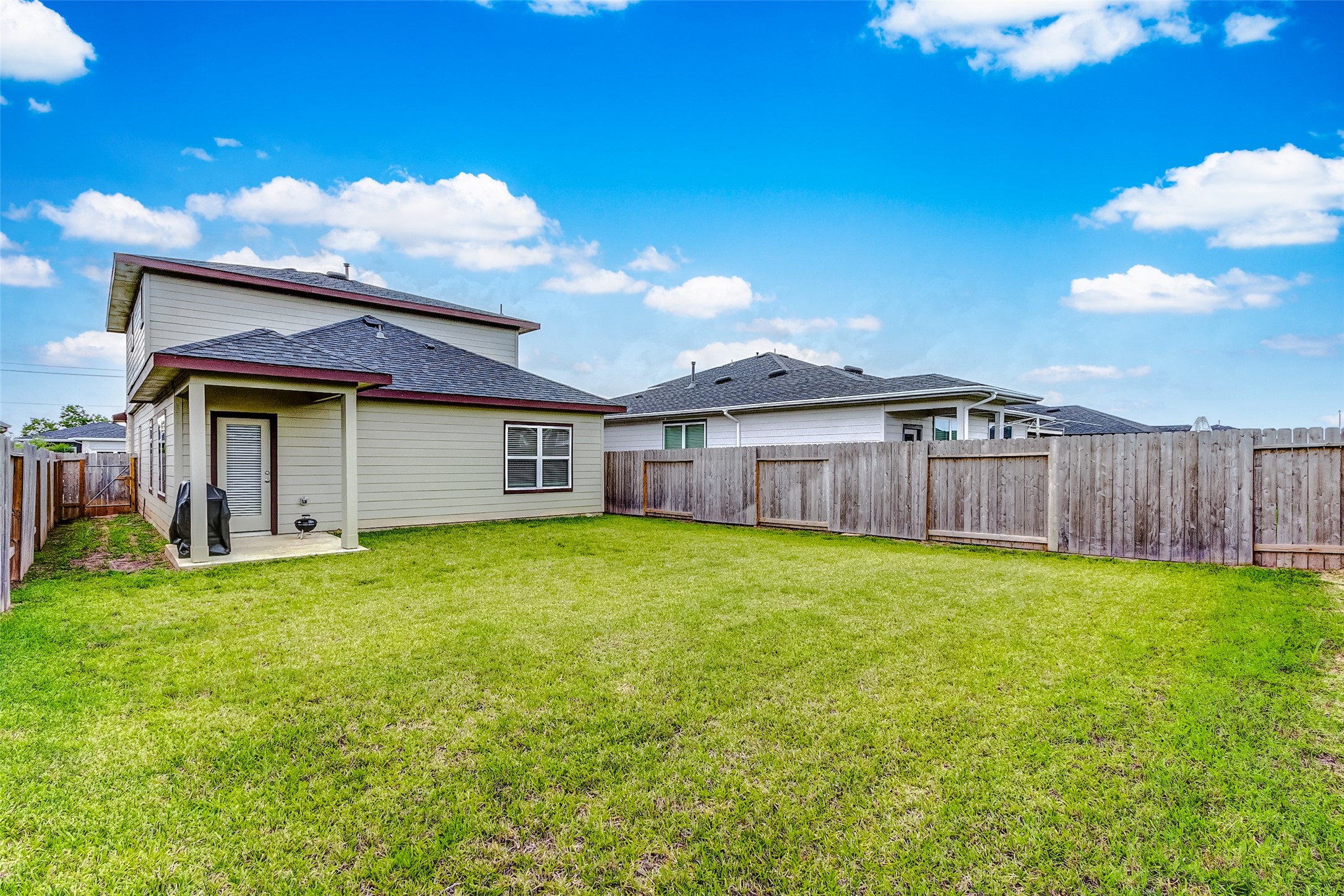 12514 Walmgate Court Houston, TX 77047 - Photo 35 of 37 a view of a house with backyard and wooden fence