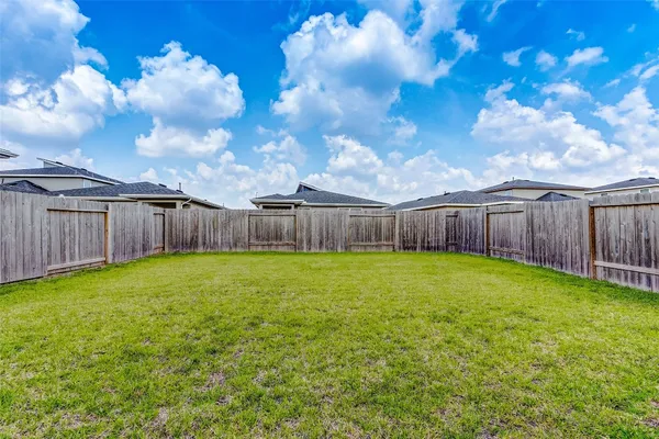 a view of a backyard with green space