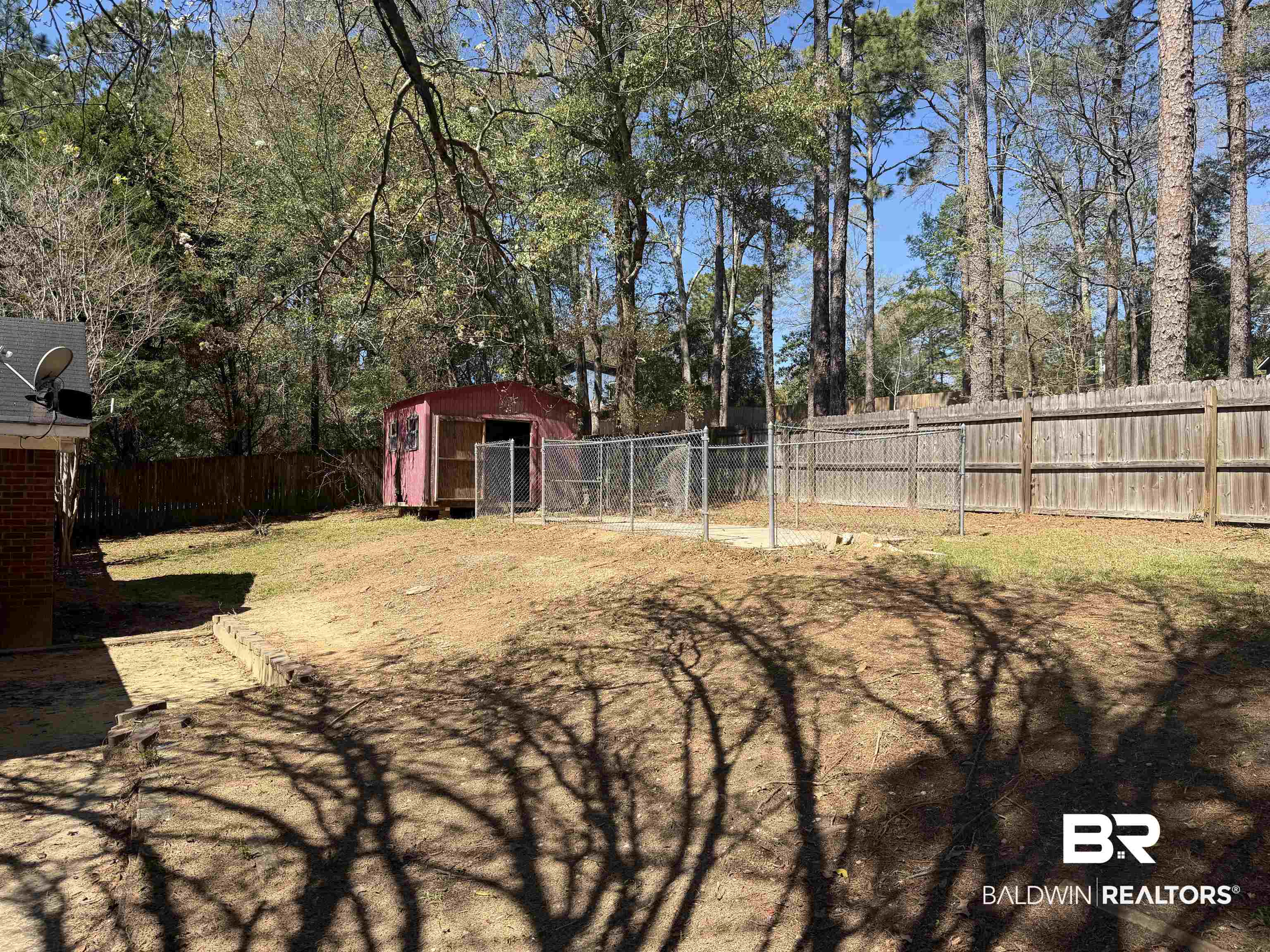 7067 Pinehill Road Daphne, AL 36526 - Photo 5 of 18 Fenced backyard featuring an outdoor structure