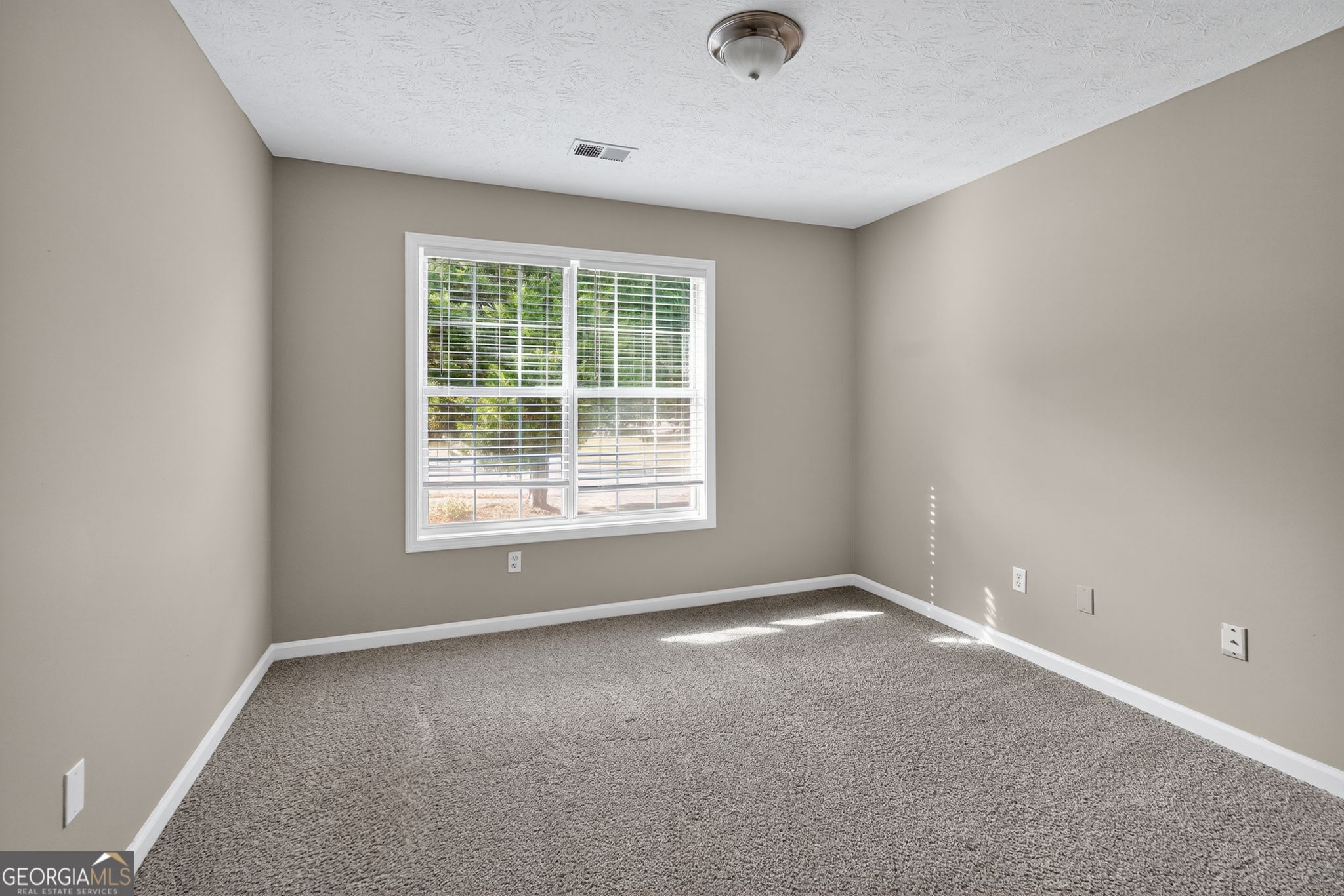 2391 Harmony Ridge Court Lithonia, GA 30058 - Photo 32 of 35 an empty room with a window