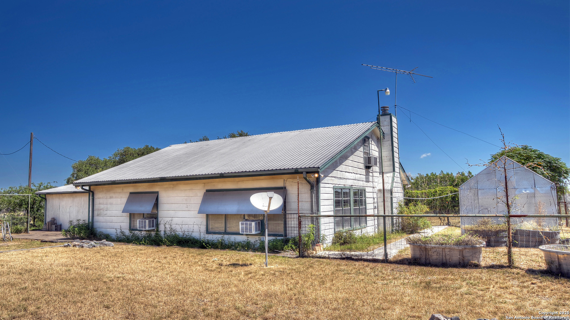 227 Mitchell Ranch Road Camp Wood, TX 78833 - Photo 2 of 72 a backyard of a house