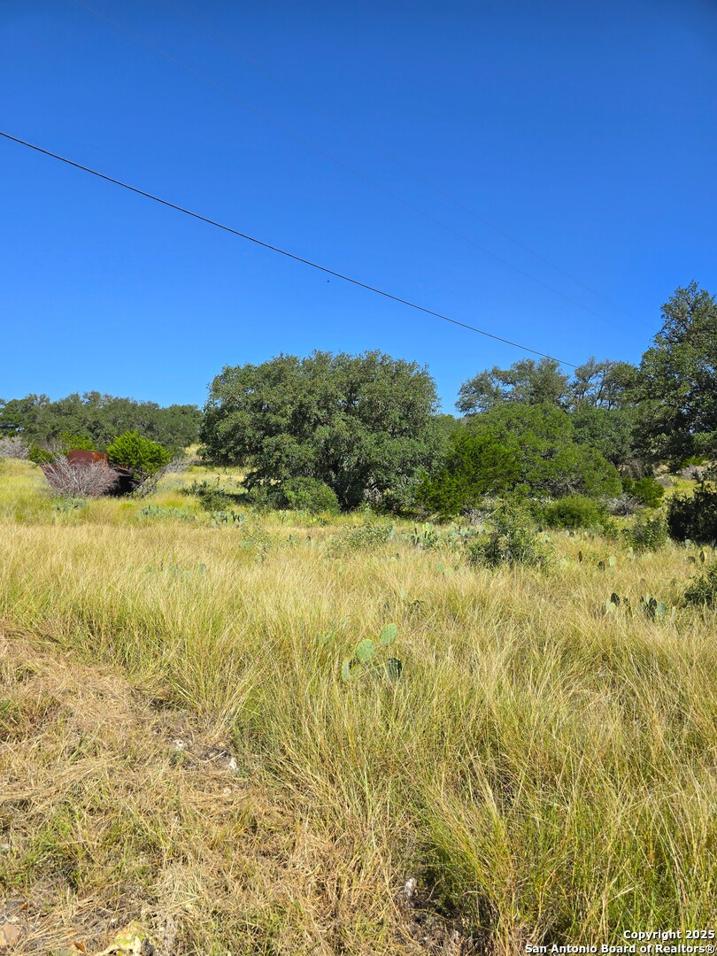 227 Mitchell Ranch Road Camp Wood, TX 78833 - Photo 35 of 72 a view of a large body of water with a building in the background