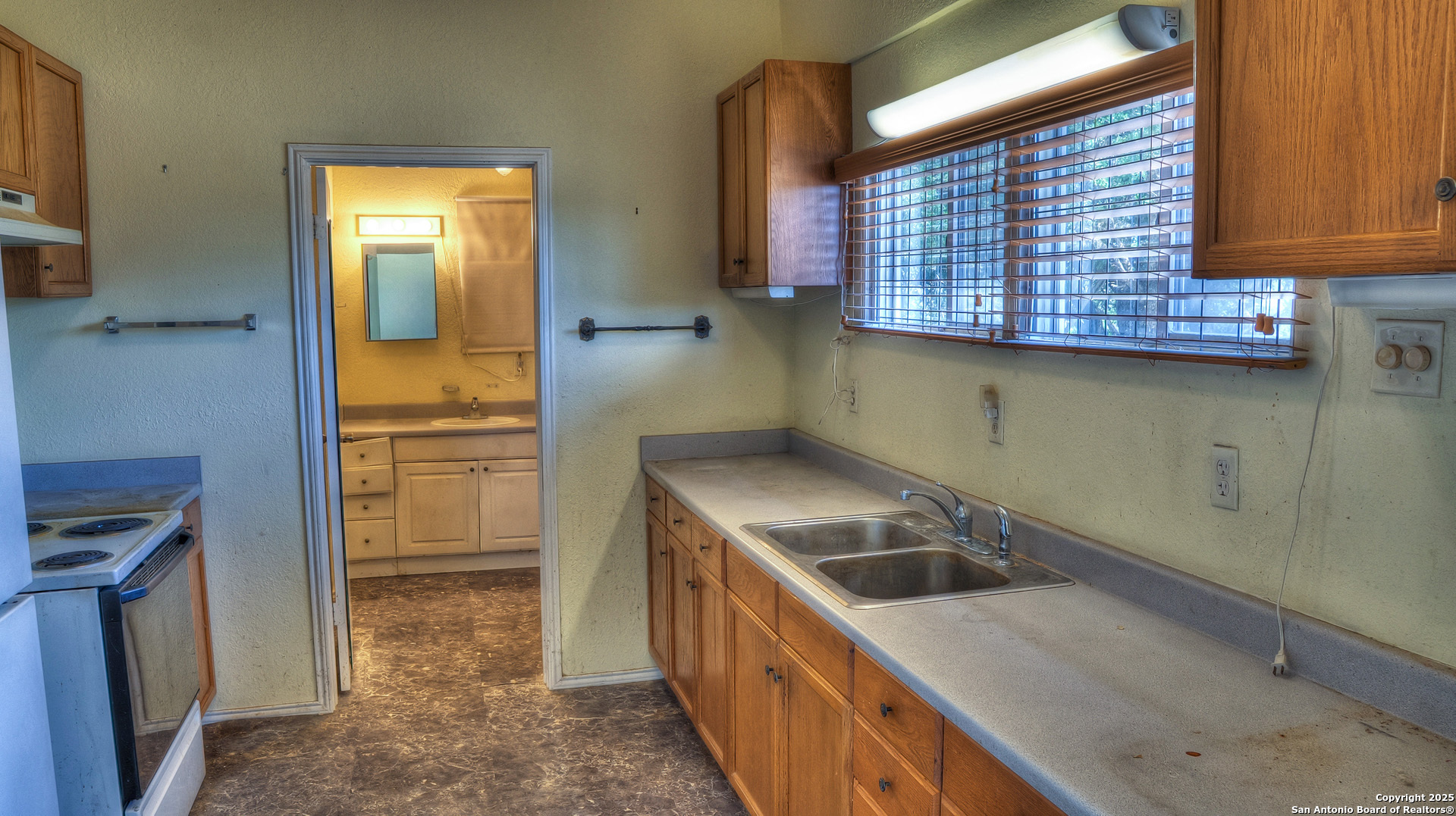 227 Mitchell Ranch Road Camp Wood, TX 78833 - Photo 5 of 72 a kitchen with a sink and a refrigerator