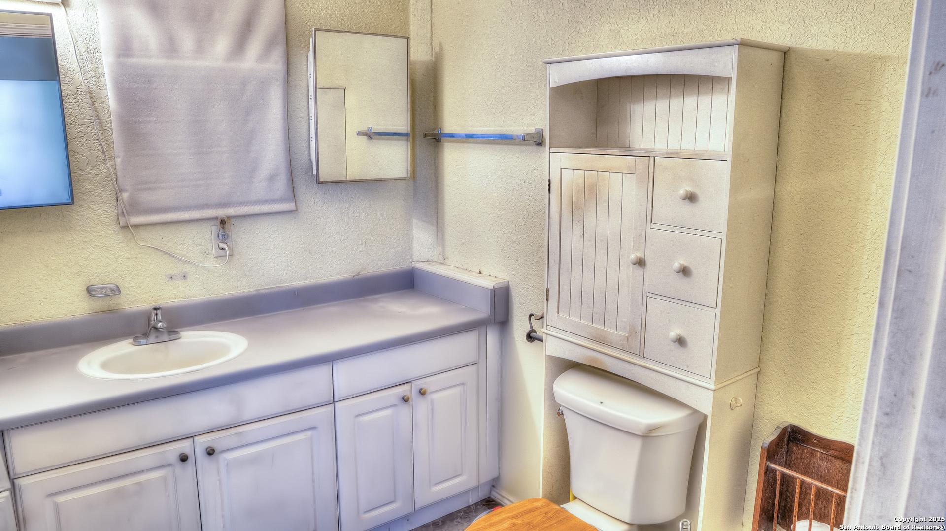 227 Mitchell Ranch Road Camp Wood, TX 78833 - Photo 7 of 72 a bathroom with a sink a toilet and shower