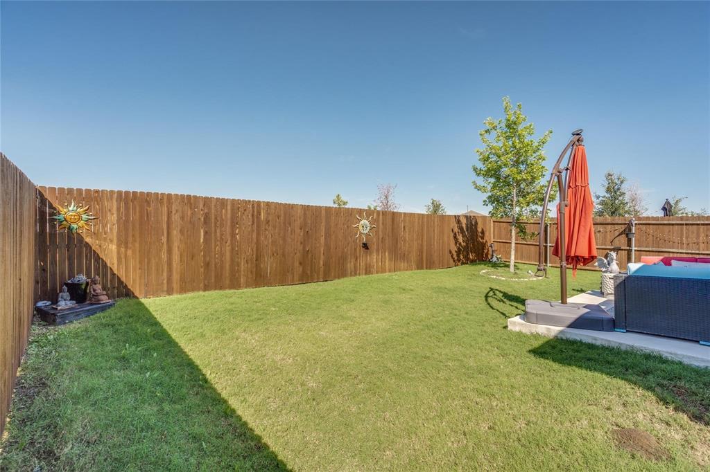 7733 Ruellia Road McKinney, TX 75071 - Photo 17 of 19 Fenced backyard featuring a patio area