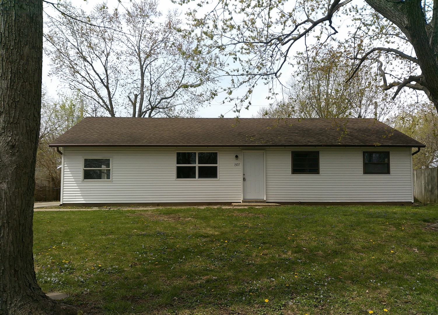 a house with yard in front of it