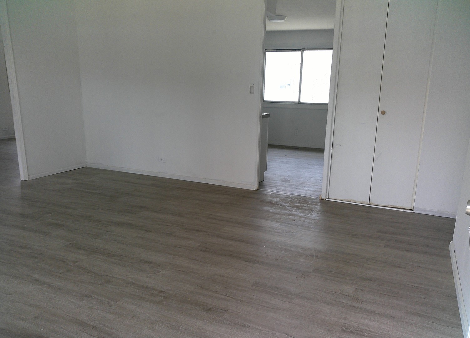 1507 Thornton Drive Champaign, IL 61821 - Photo 2 of 16 an empty room with wooden floor and windows