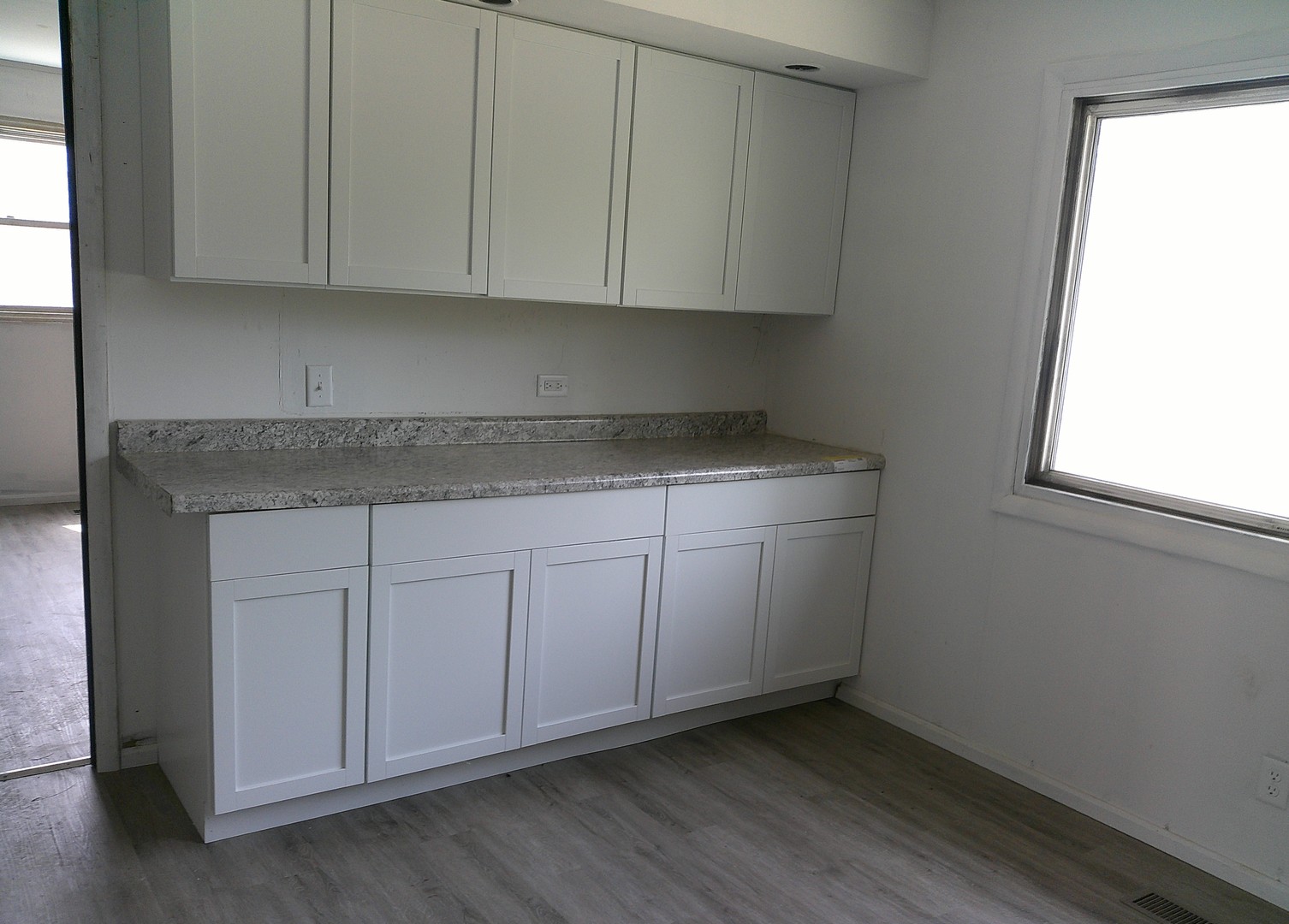 1507 Thornton Drive Champaign, IL 61821 - Photo 6 of 16 a view of cabinets with wooden floor