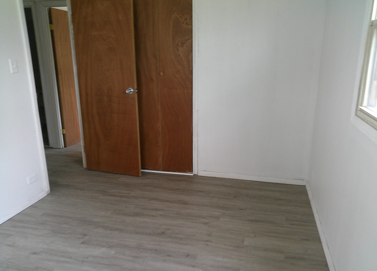 1507 Thornton Drive Champaign, IL 61821 - Photo 9 of 16 a view of an empty room with wooden floor