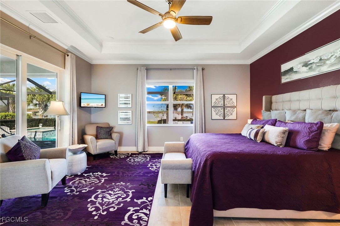 13424 Blue Bay Circle Fort Myers, FL 33913 - Photo 14 of 45 a bedroom with a large bed and a couch