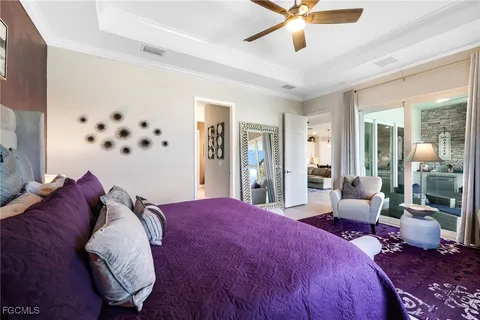 a spacious bedroom with a bed and window